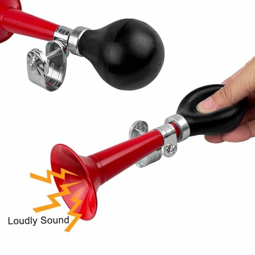 Hand squeezing a red bicycle air horn with a loud sound indication.