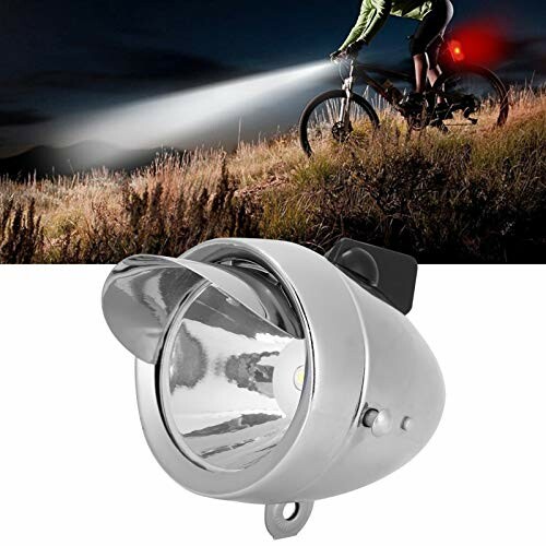 Cyclist using a headlight on a dark trail.