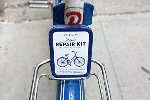 Bicycle repair kit mounted on bike frame.